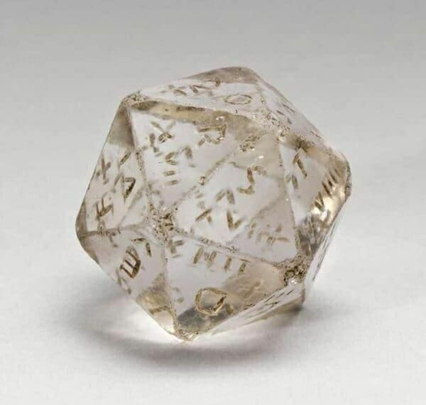 A crystal die with markings, 20-sided