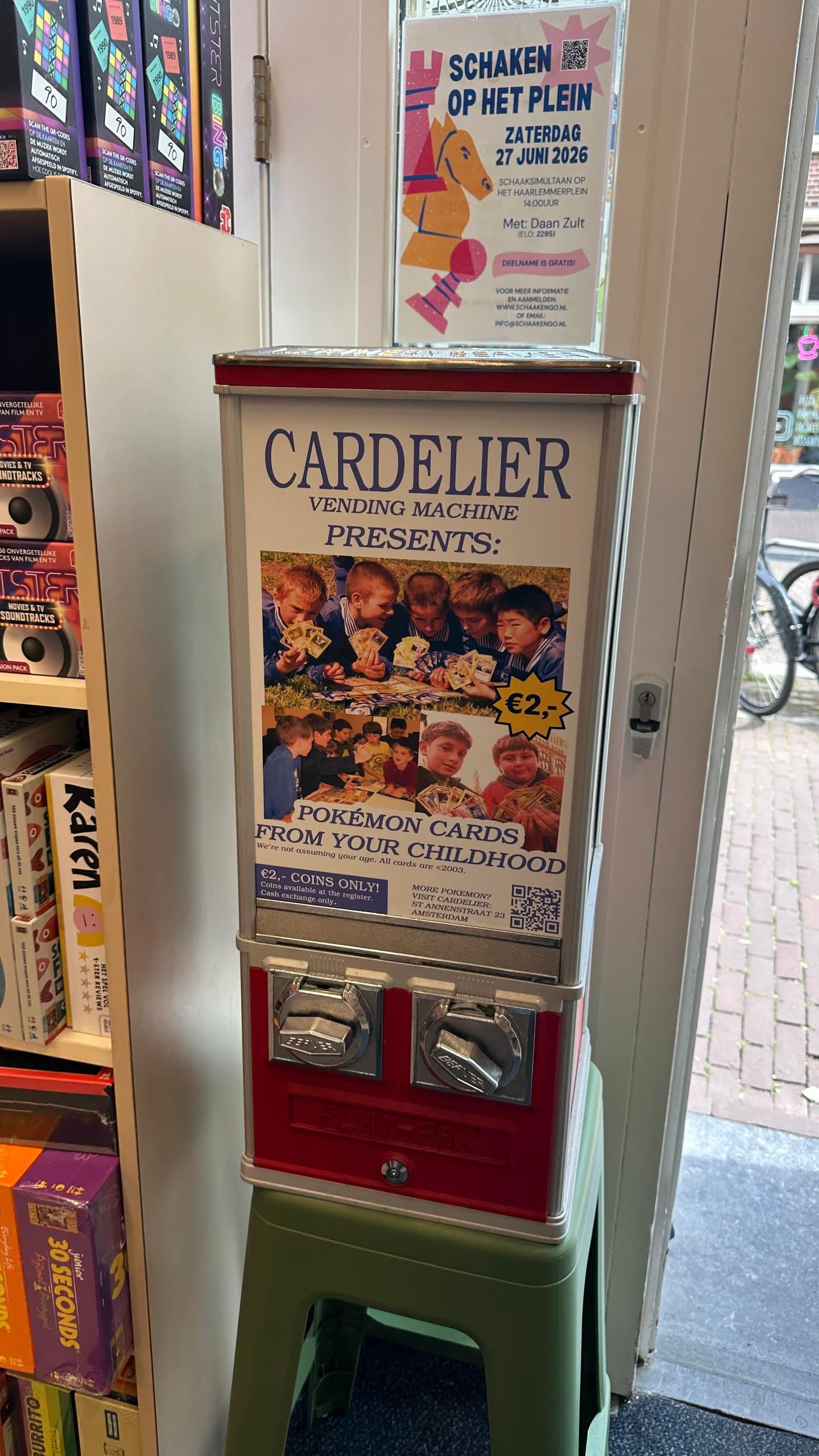 coin vending machine labeled "Pokemon cards from your childhood.  We're not assuming your age. All cards < 2003" for 2 euros in coins.
