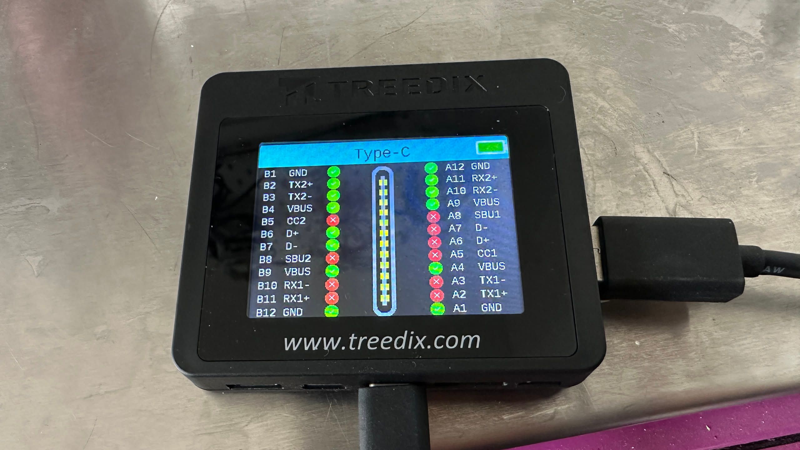 USB-A to C cable plugged into a treedix tester, showing that many of the pins not connected.