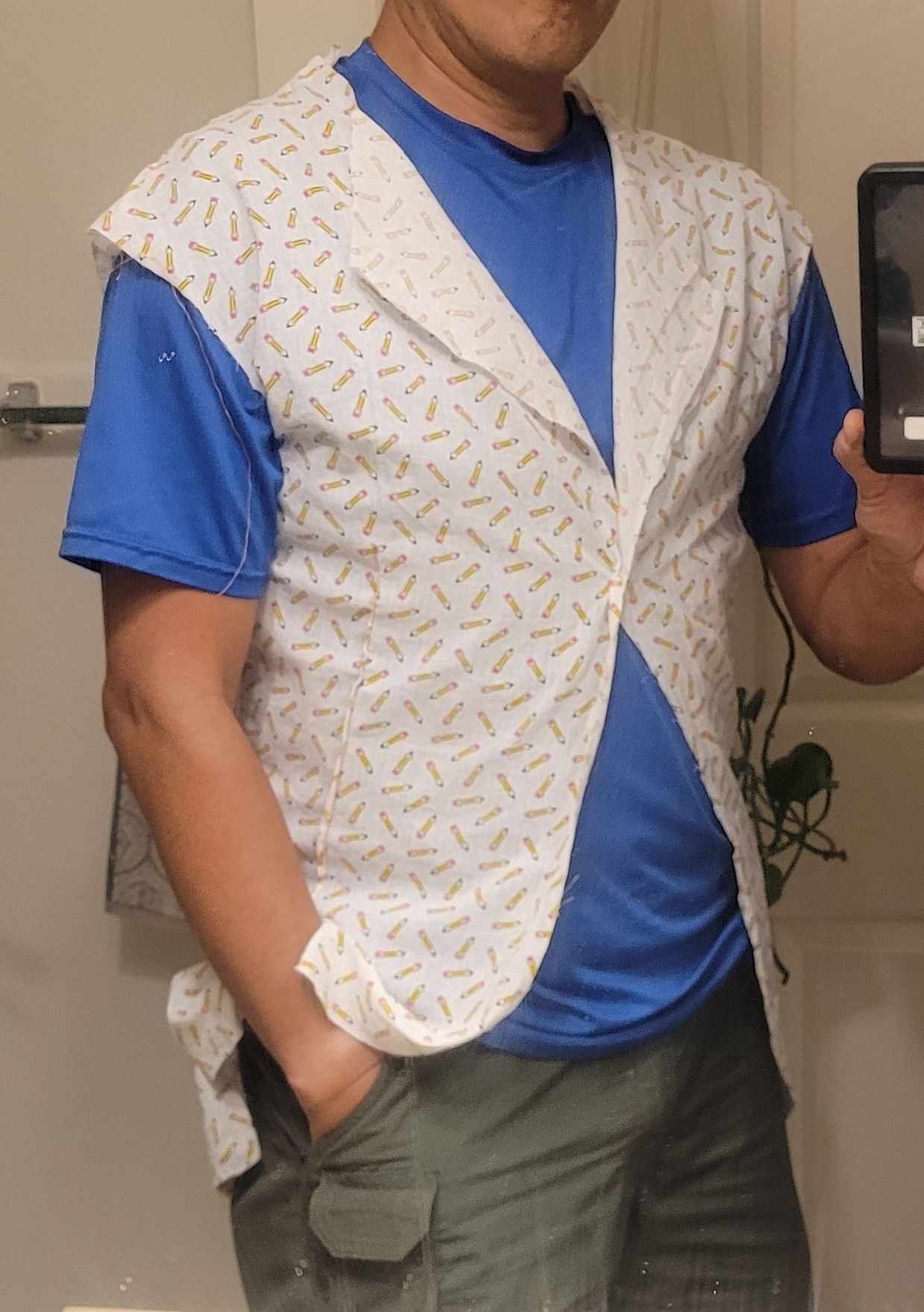 Man wearing some strange white shirt over a blue scout t shirt