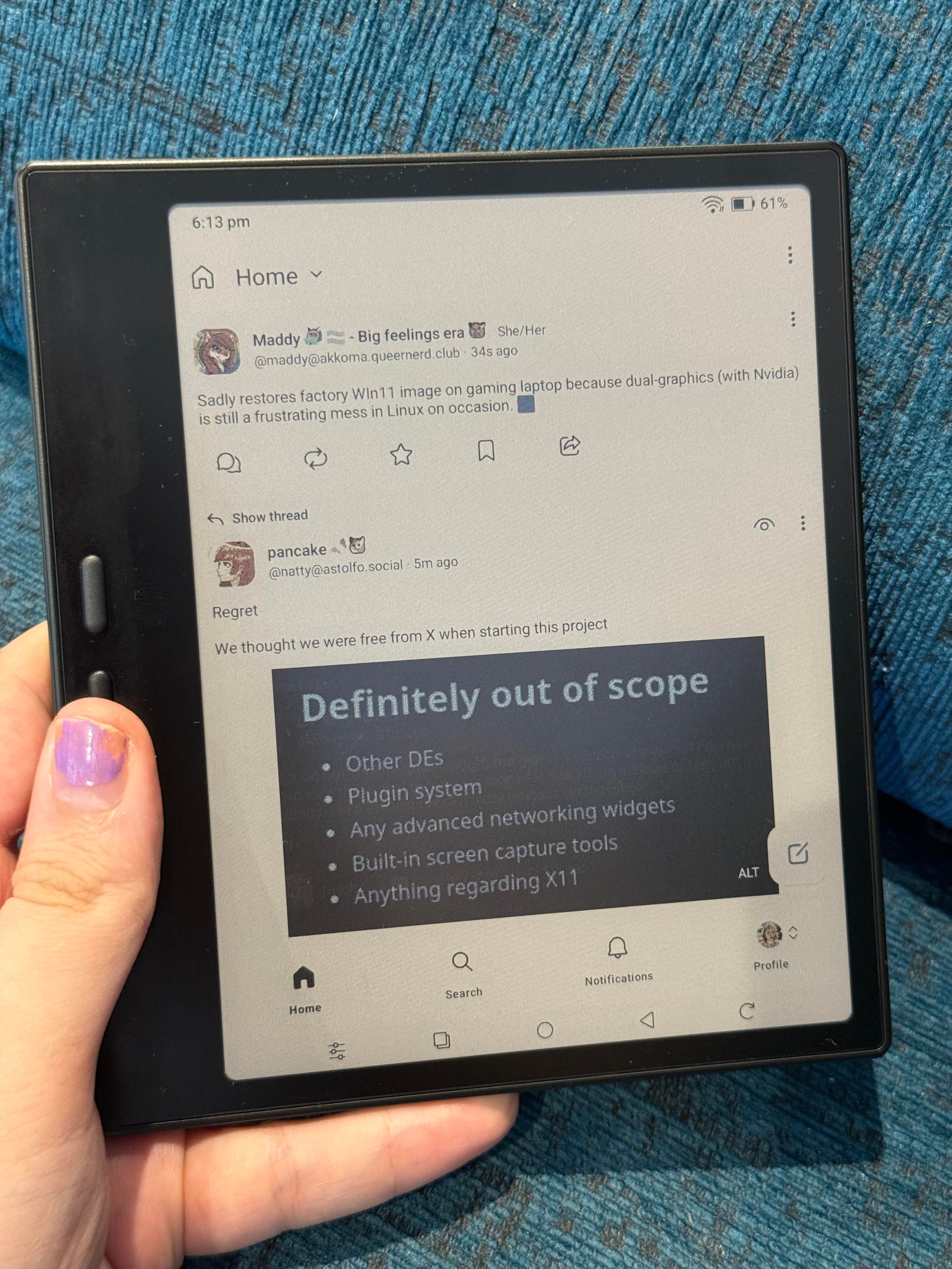 A boox 7 inch e-ink tablet running a fedi client showing the home timeline.