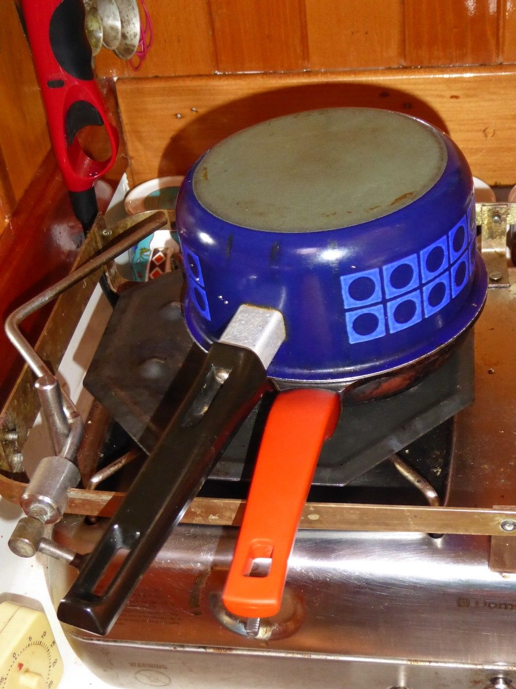 bread baked in a sauce pan, with a frying pan laying overtop, but the whole thing was flipped so now the saucepan is on top and the frying pan at the bottom. The saucepan is sitting over a flame tamer to spread the flame better on an LPG stovetop.