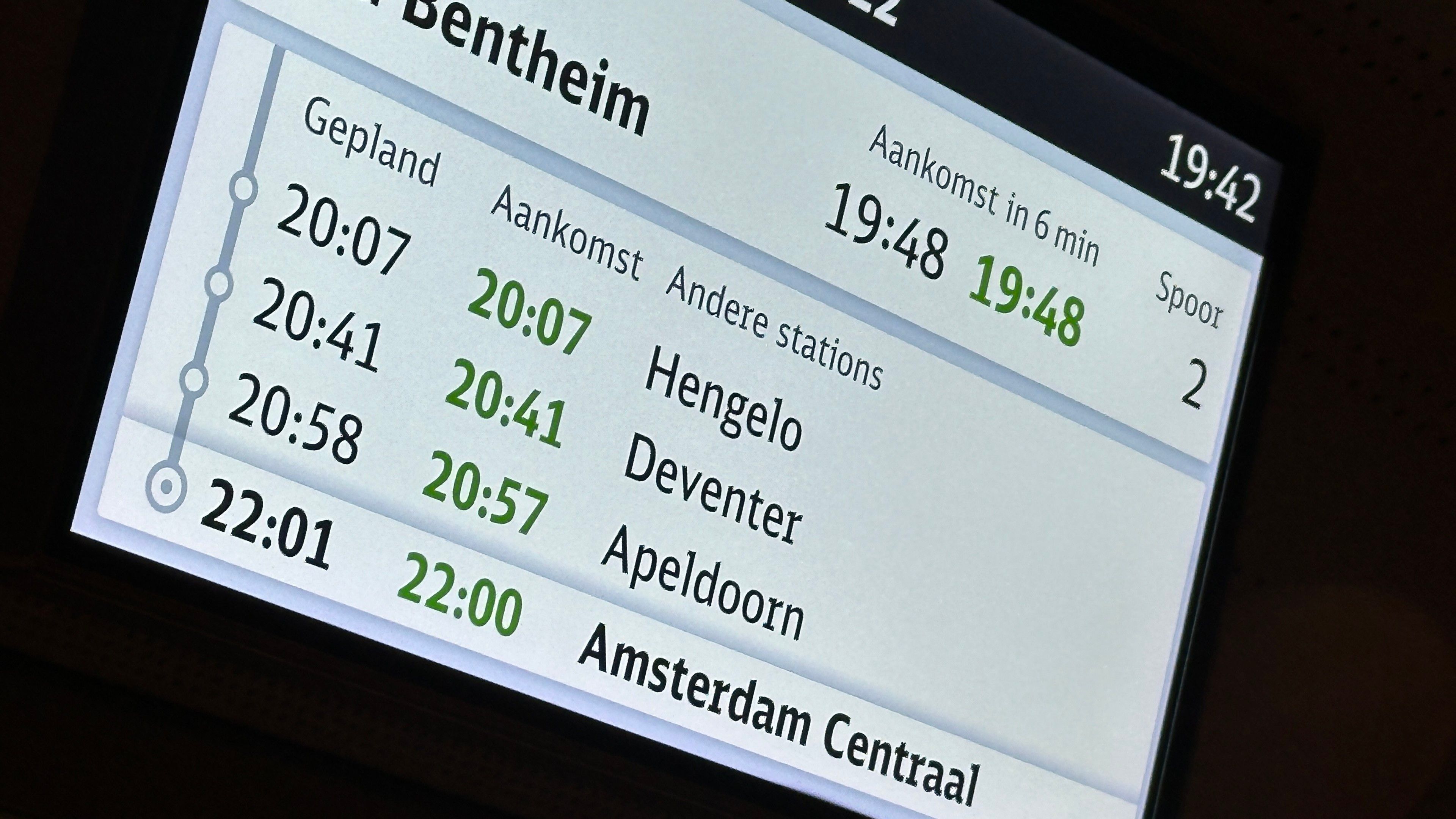 Train information display with amsterdam centraal planned at 22:01 and estimated 22:00