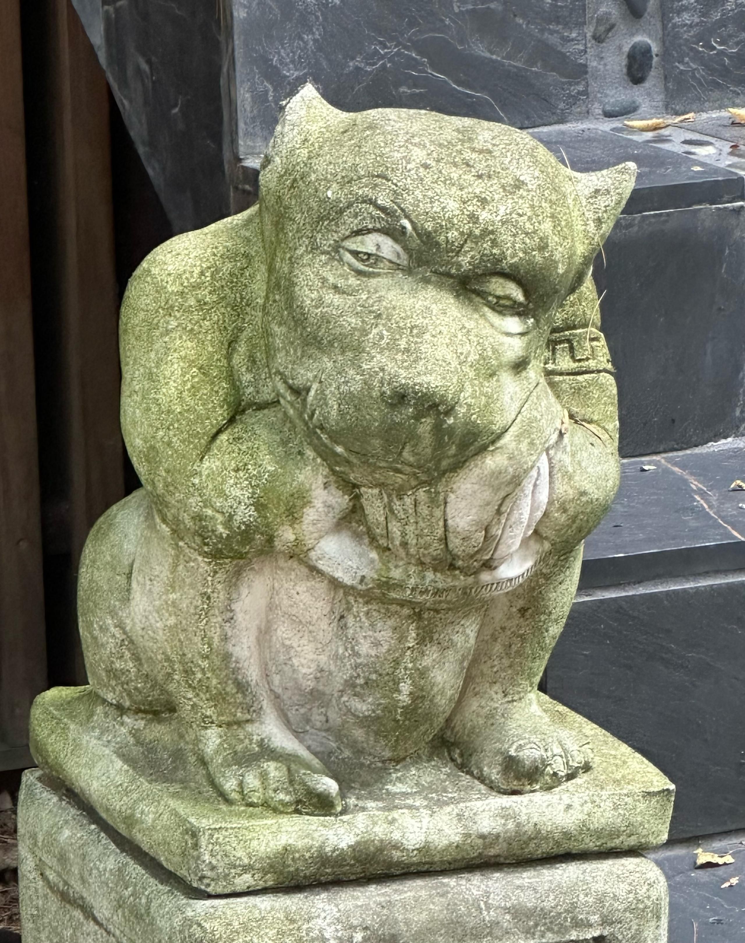 A weirdly detailed and grotesque little porch gargoyle