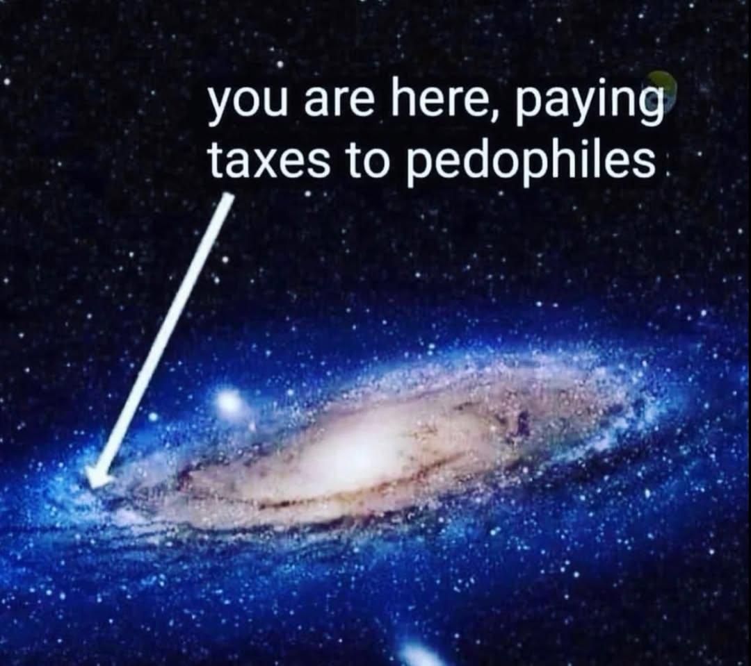A picture of the Milky Way galaxy. A thick white arrow is pointing towards the extreme periphery of the galaxy. The arrow is labelled "you are here, paying taxes to pedophiles"