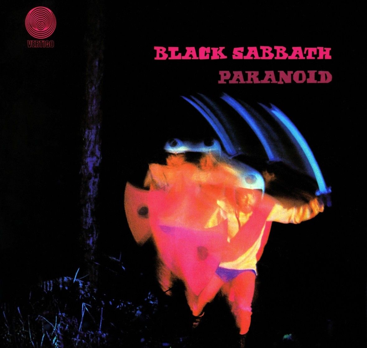 Picture of album cover, dark background with red lettering. Long exposure picture of man running with a sword and a shield in darkness 