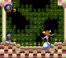 A screenshot from Donald Duck No Mahou No Boushi. 
It shows Donald standing in a checkboard arena, in front of him is a Juggler standing in a ball.