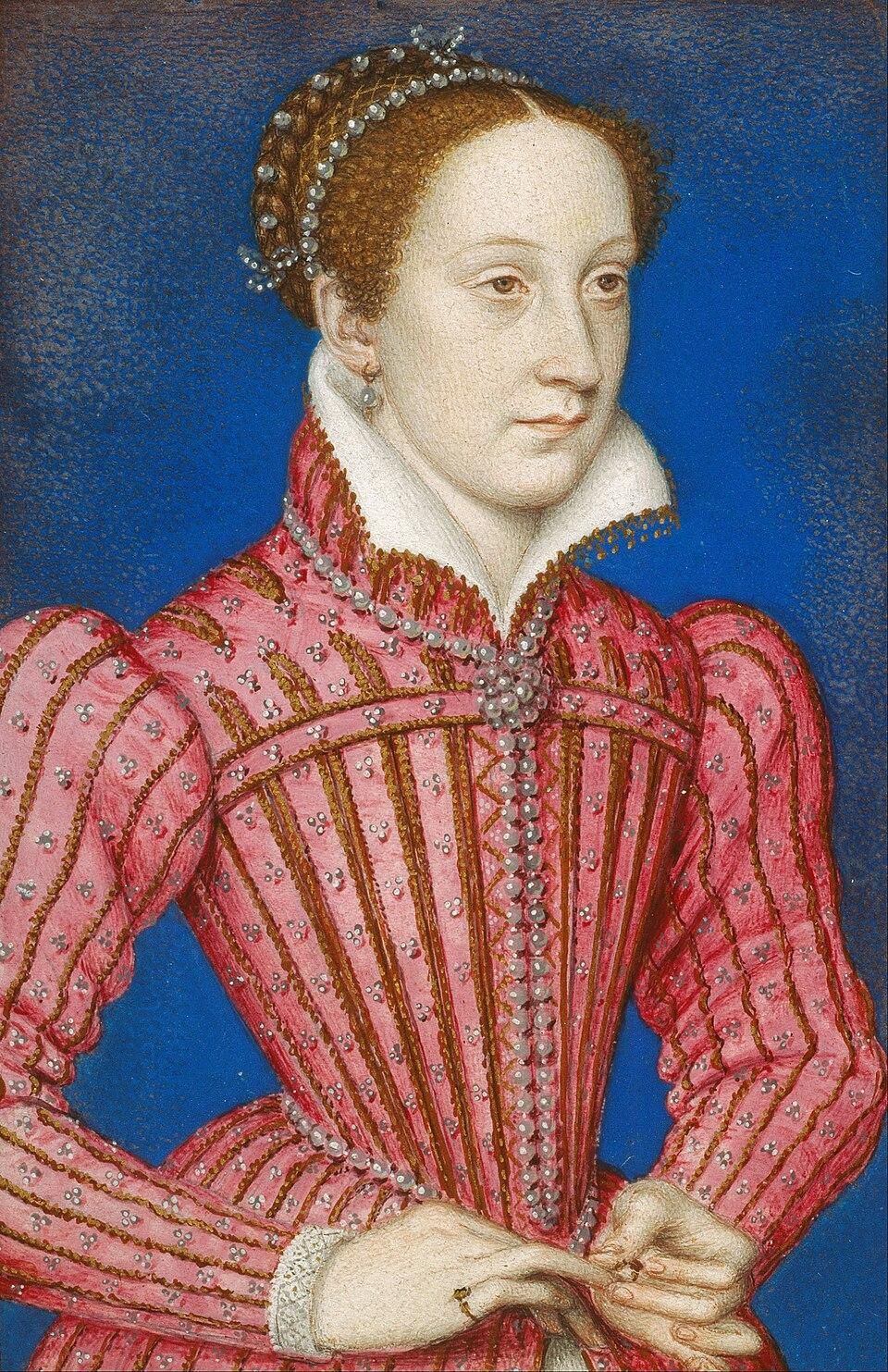 François Clouet - Mary, Queen of Scots (1542-87)

Mary wears a pink gown decorated with vertical gold striping and small jeweled embellishments. The bodice is tightly fitted and fastened down the center with a line of pearls or gemstone buttons. A crisp white ruff collar frames her neck. Her sleeves are full and carefully tailored.

Her hair is light brown and drawn back smoothly, partially covered by a jeweled headband adorned with pearls. She wears modest jewelry, including a pearl necklace, small earrings, and a ring. Her hands are delicately posed at her waist, fingers gently touching.

https://en.wikipedia.org/wiki/Mary,_Queen_of_Scots#/media/File:Fran%C3%A7ois_Clouet_-_Mary,_Queen_of_Scots_(1542-87)_-_Google_Art_Project.jpg