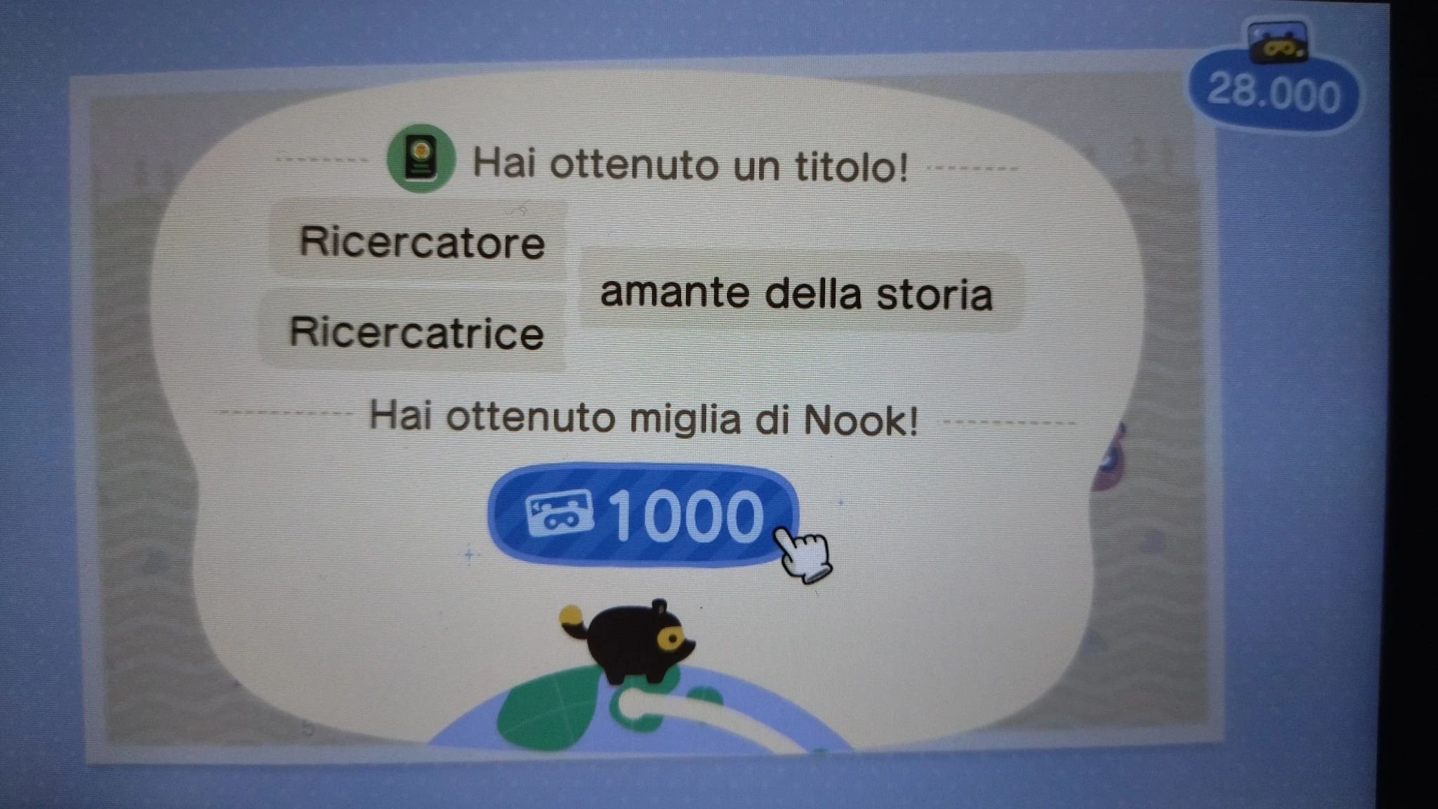 Schermata di un premio di 1000 miglia di Nook per il traguardo di 100 fossili; ottenuto il titolo Ricercatore/Ricercatrice amante della storia