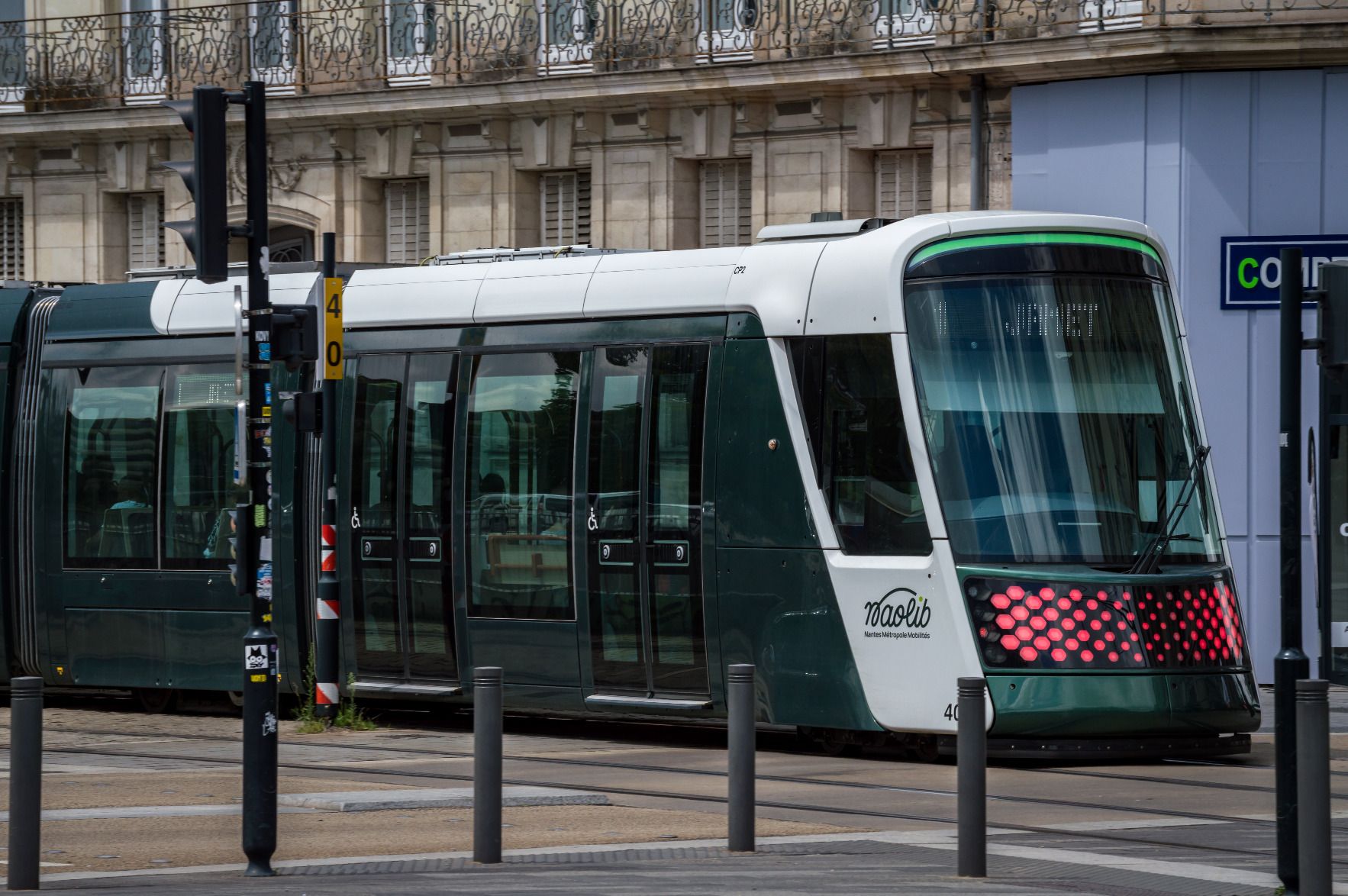 Nantes tram with vehicle number 403 running on the street
