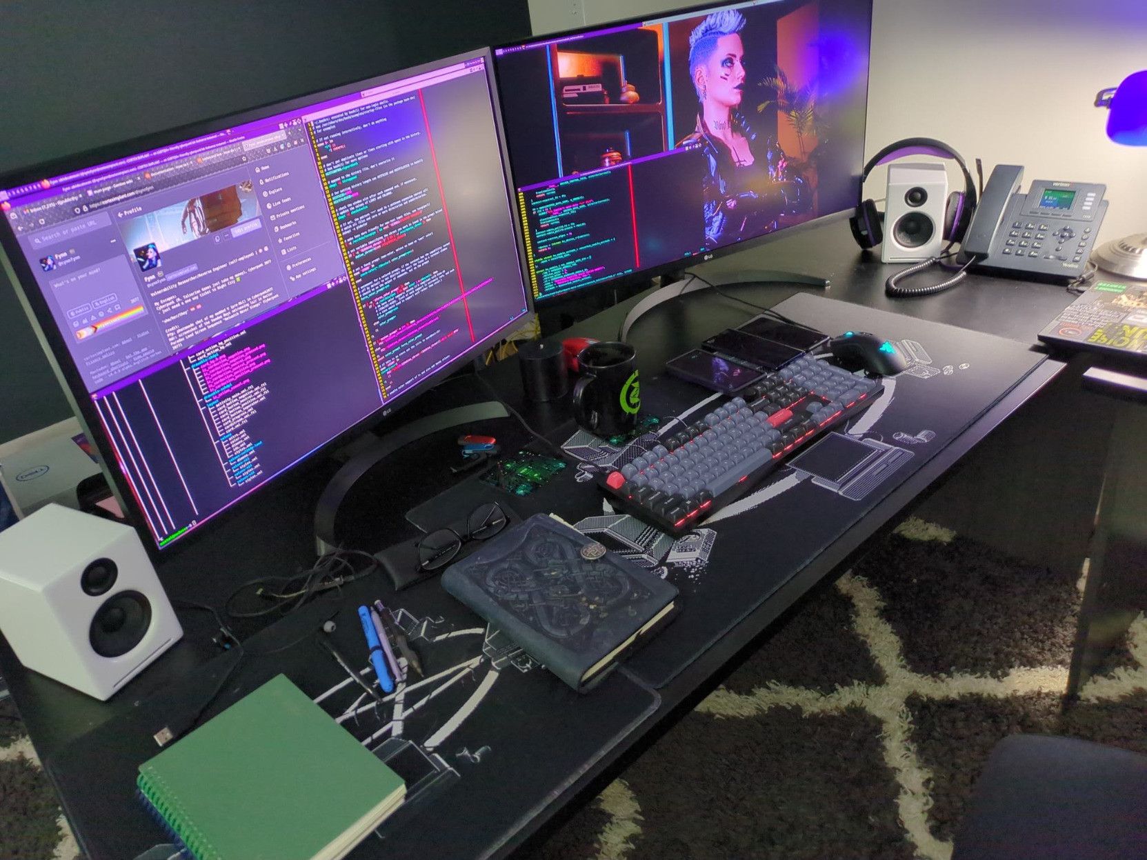 My home office desk with two monitors, speakers, mouse, keyboard, phone, dirty mug from hot cocoa, some notebooks, pens, mechanical pencils, handful of usb drives and multiple cell phones for my work.