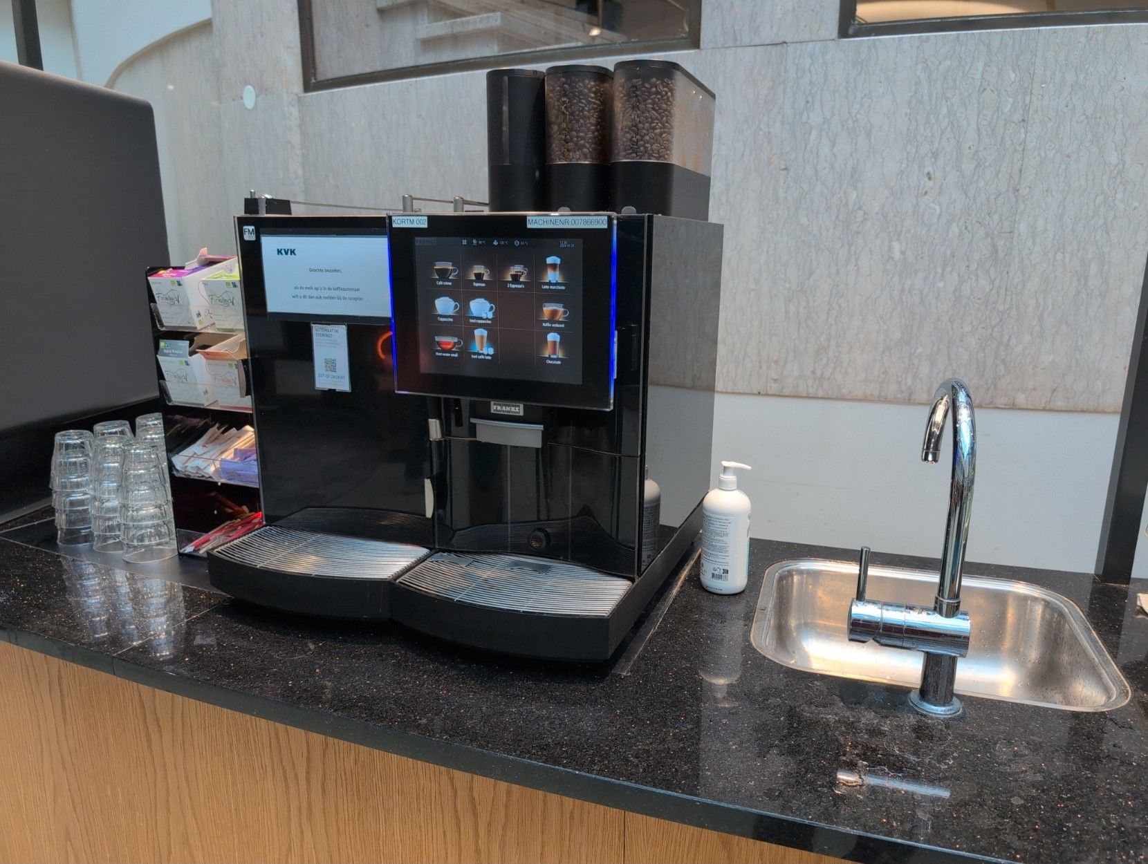 Free coffee machine and a sink.