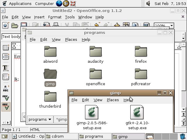 A screenshot of Ubuntu 4.10 running Gnome 2.8. There's Open Office in the background, and a file manager showing the contents of the CD in the foreground. The CD has all sorts of Windows programs