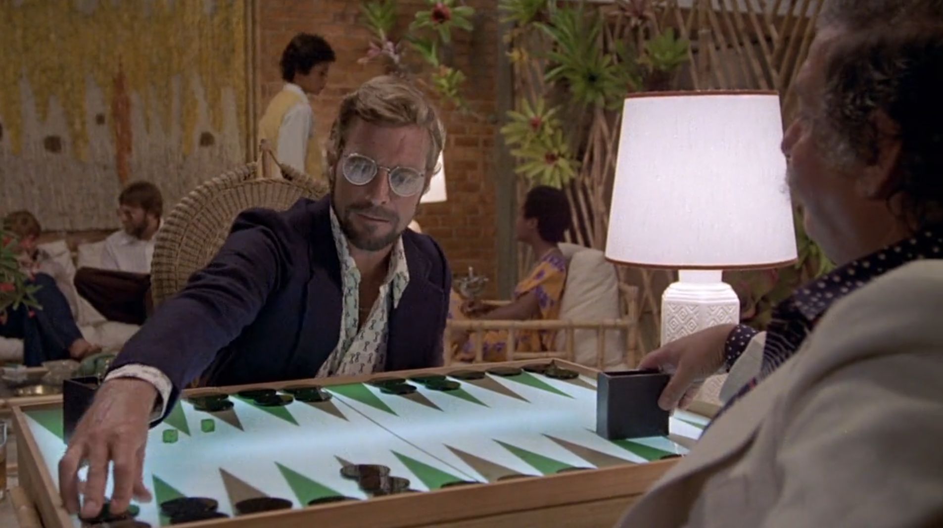 2 men play an elaborate game of backgammon.