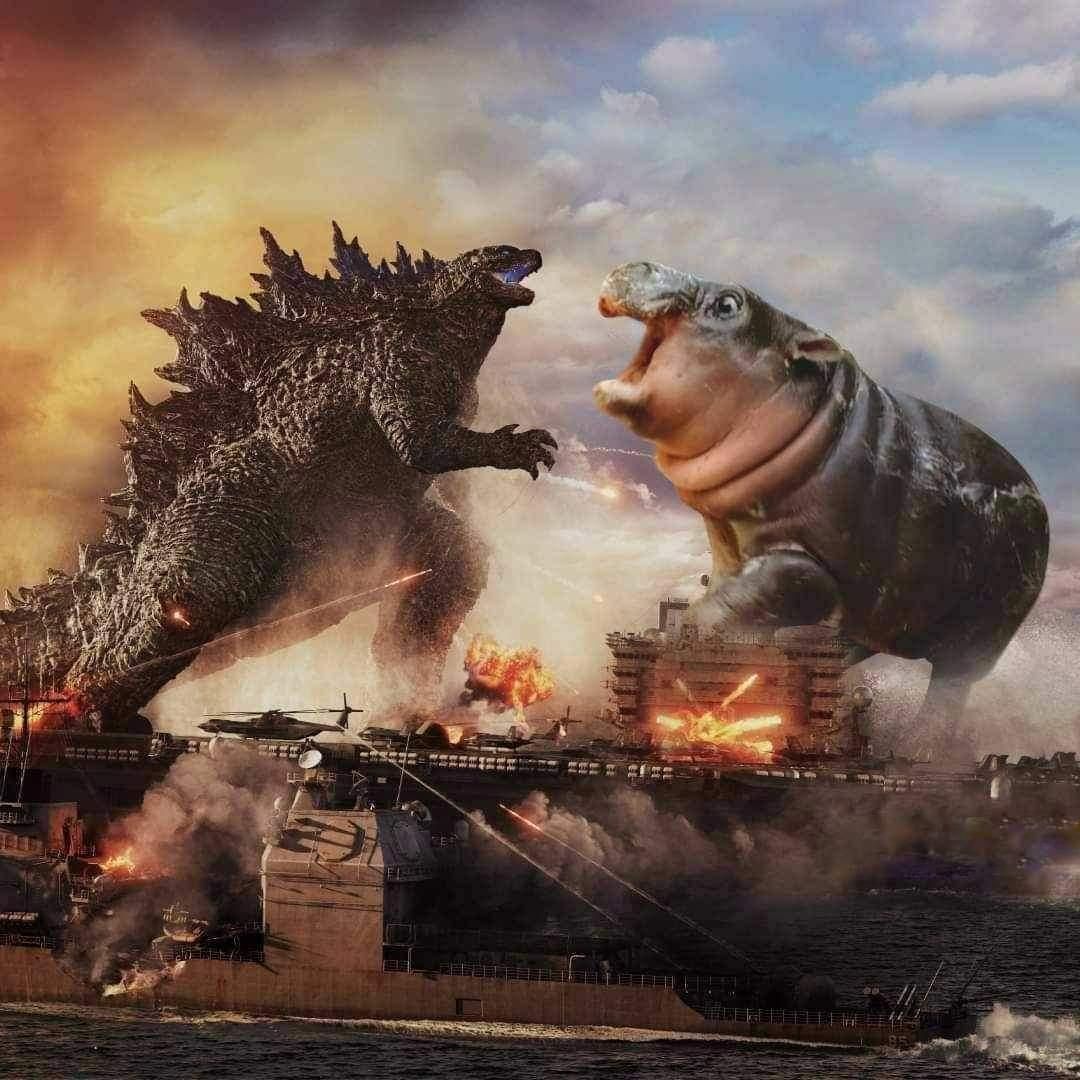 Kaiju fight with military vehicles all around, but one of the kaiju is just Moo Deng the hippo
