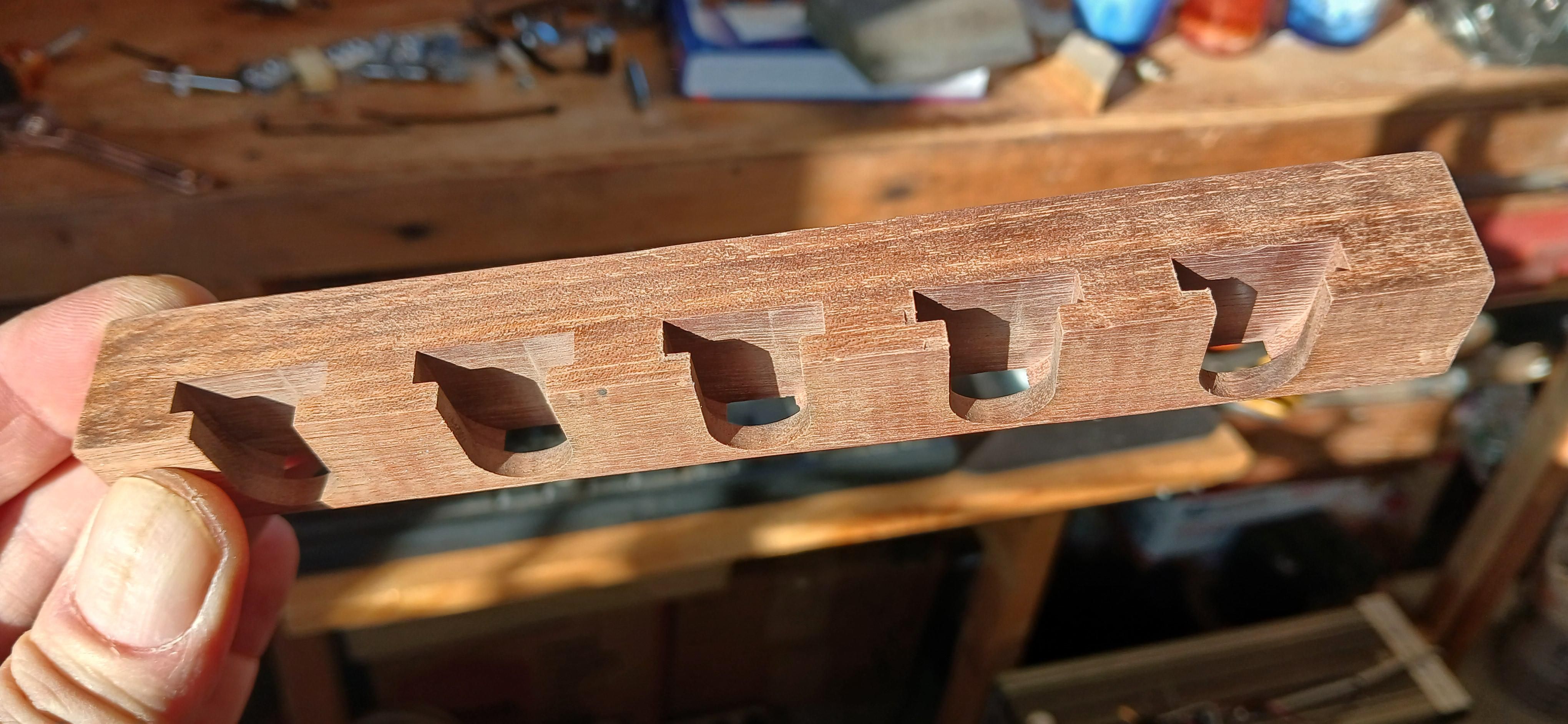Walnut with five U shaped slots