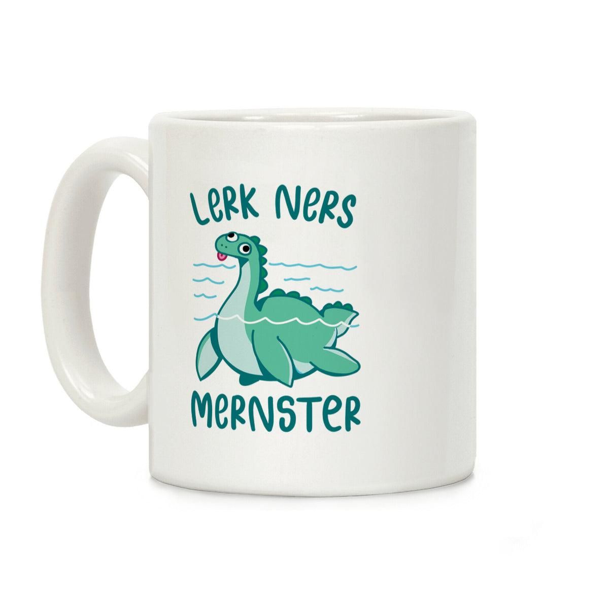 A white ceramic mug featuring a cartoon illustration of the Loch Ness Monster. The creature is teal with a derpy expression and its tongue sticking out, partially submerged in blue water waves. Above the illustration, teal text reads "LERK NERS," and below it, the word "MERNSTER" is written in the same font and color.