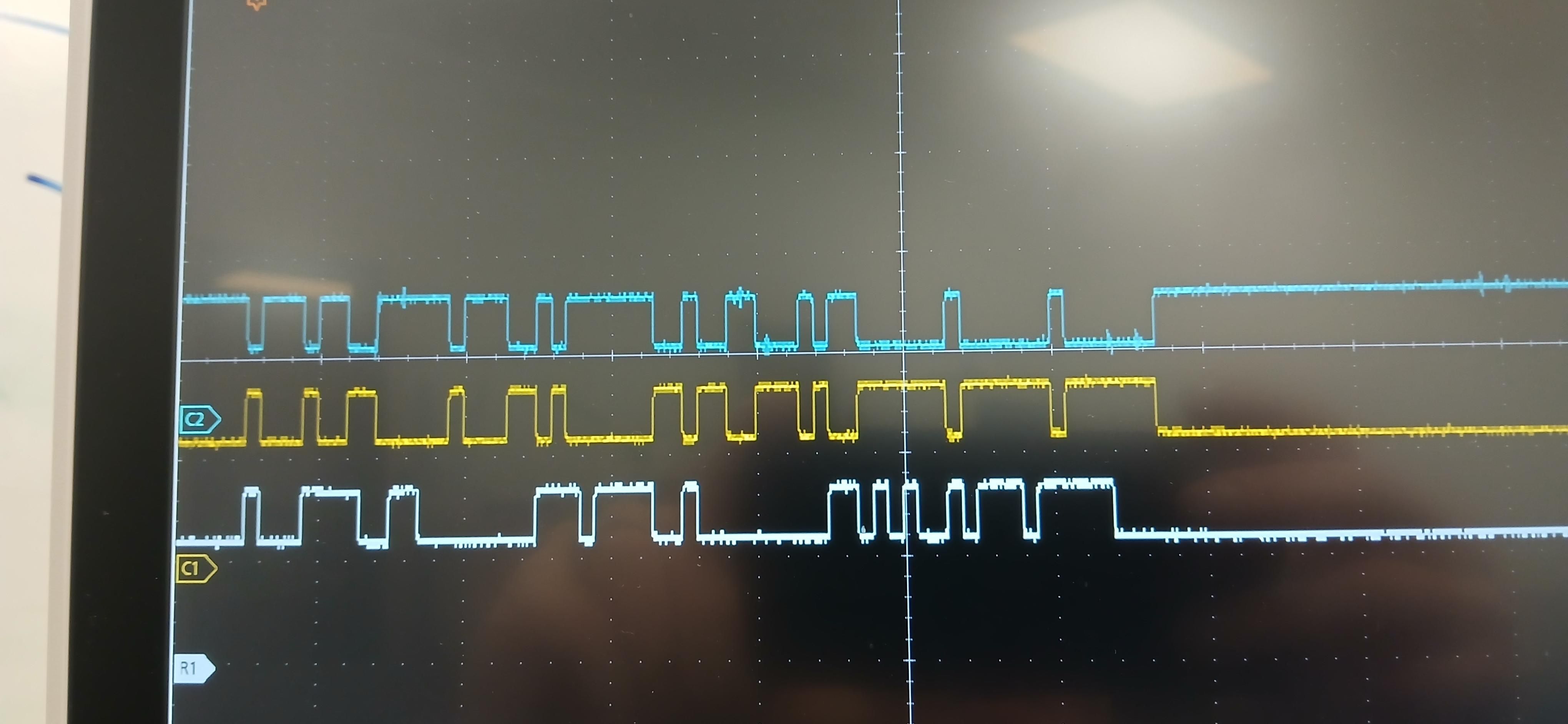 A bunch of digital waveforms on a scope, in three different traces