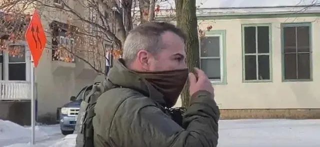 A picture of Jonathan Ross, an ICE agent in snow with a face covering who shot Renee Good.