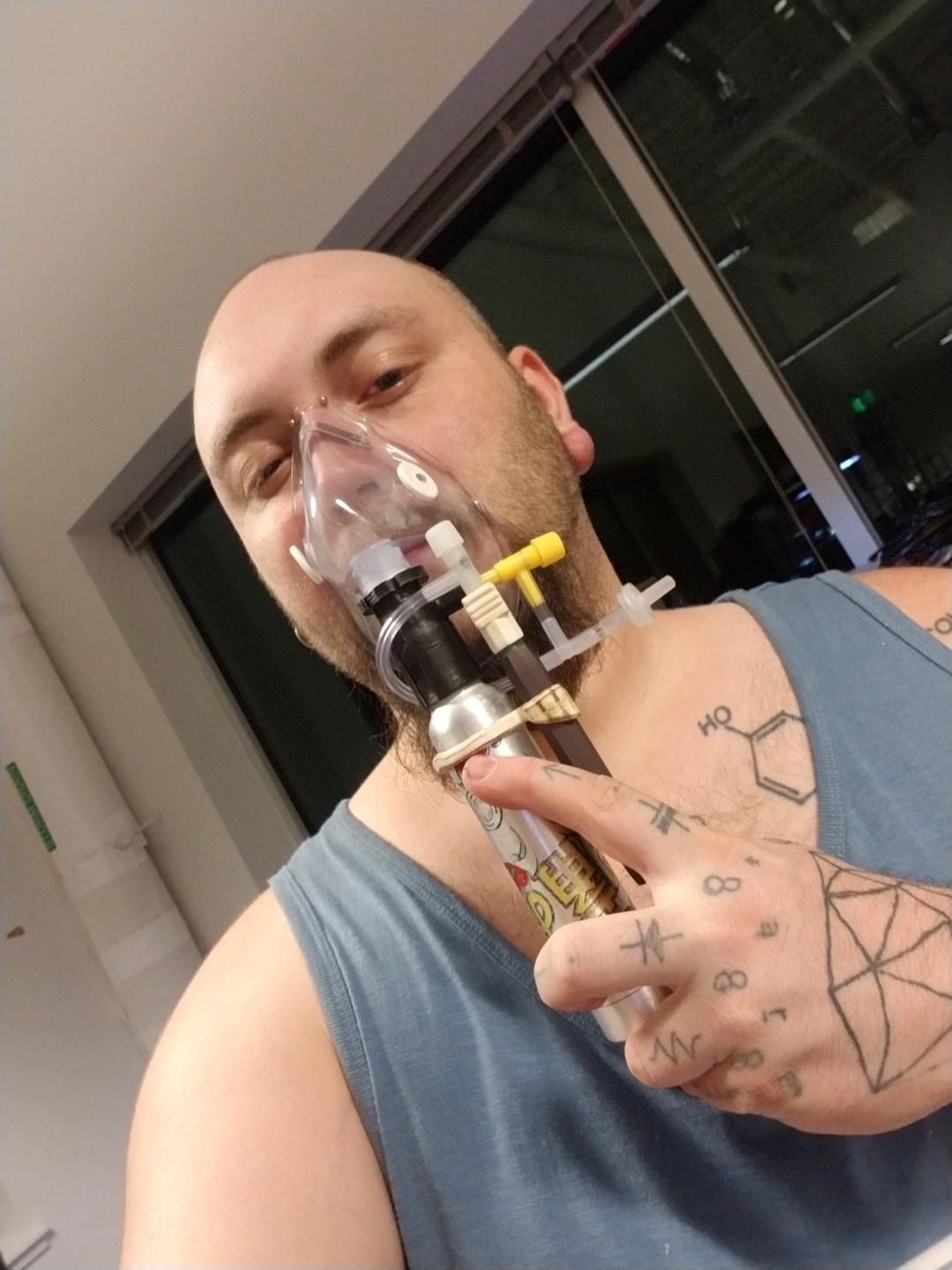 Selfie, holding a small inhaler device