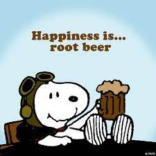 A picture of Snoopy holding a root beer float and smiling with the caption "Happiness is...root beer".