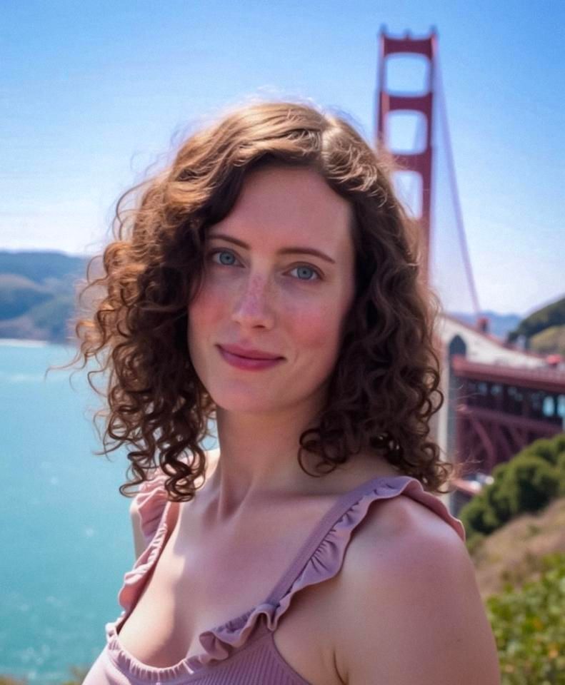 Eva standing in front of the north side of the Golden Gate bridge, wearing a purplish-rose summer sun dress, looking towards the camera. a soon to develop sunburn is emboldening her freckles, as adjacent sun rays brighten her curls in a light breeze.