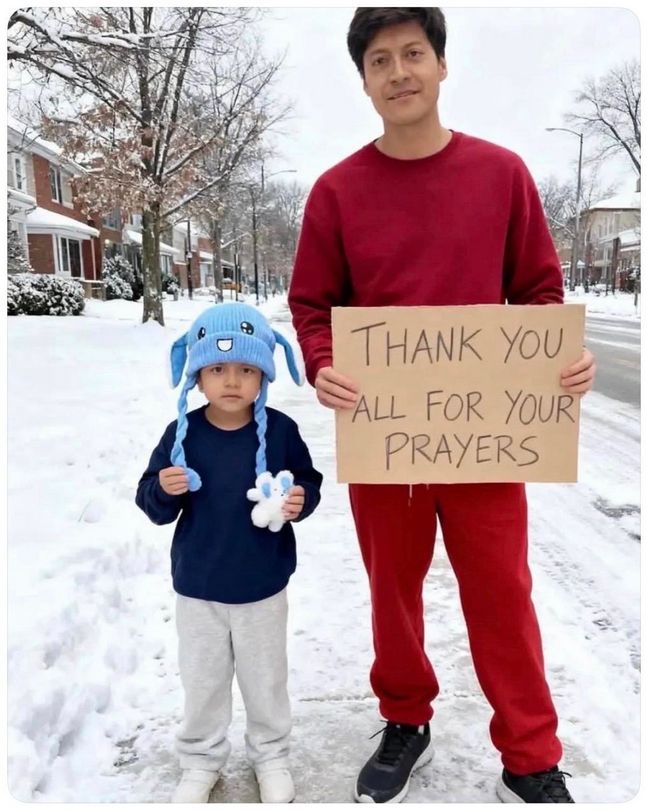 Liam - a five year od child -- is on the left, wearing a bunny hat. His father is on the right, holding a sign that says "thank you for your prayers". 