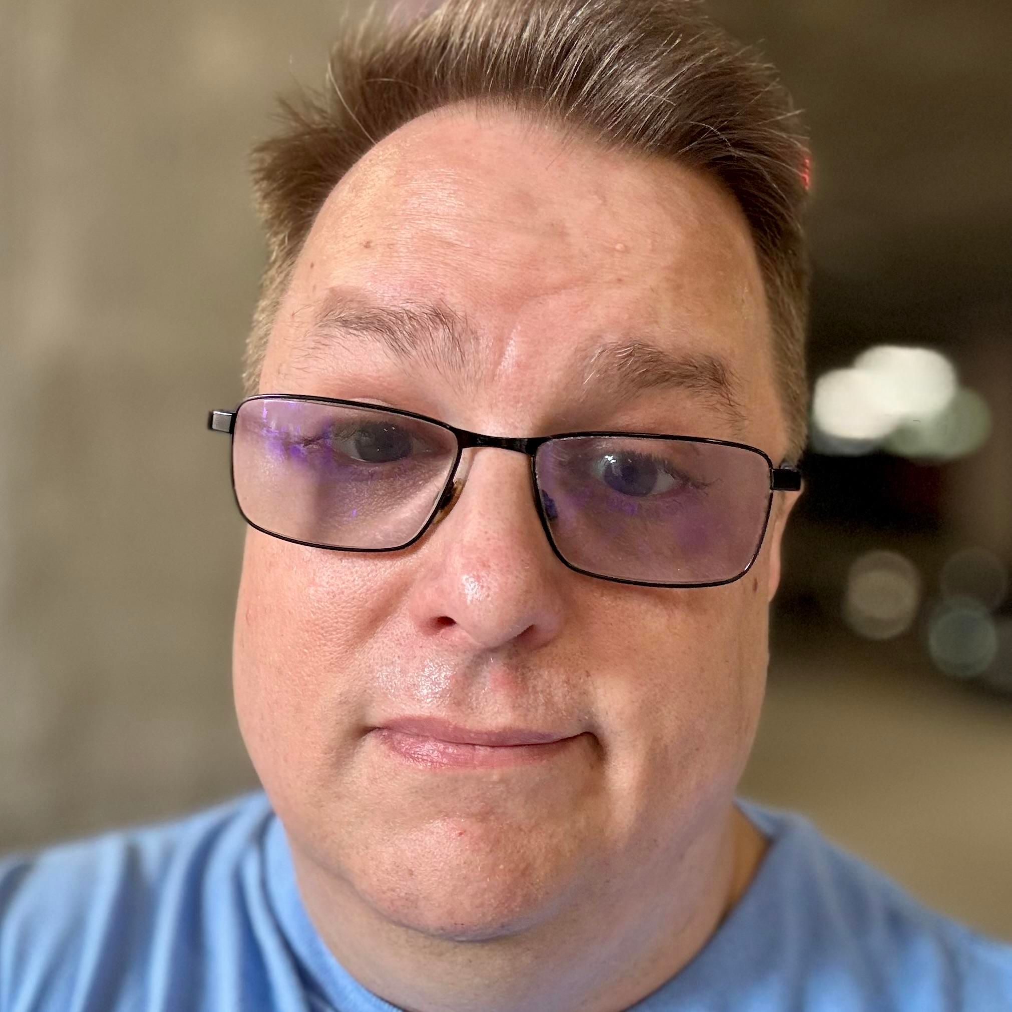 “After” selfie: short hair, clean-shaven