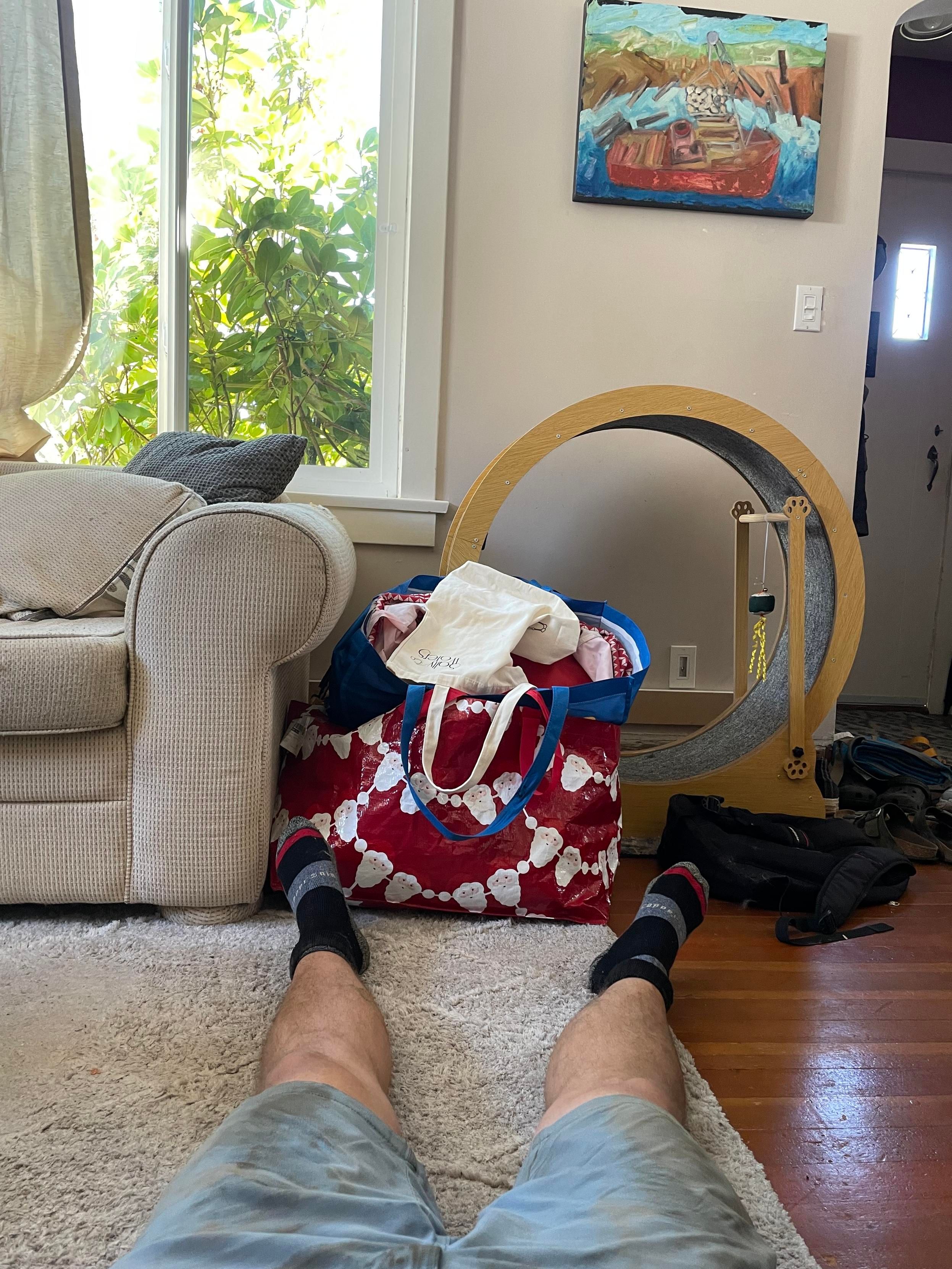 My legs out on the floor in front of me as I collapsed on the floor