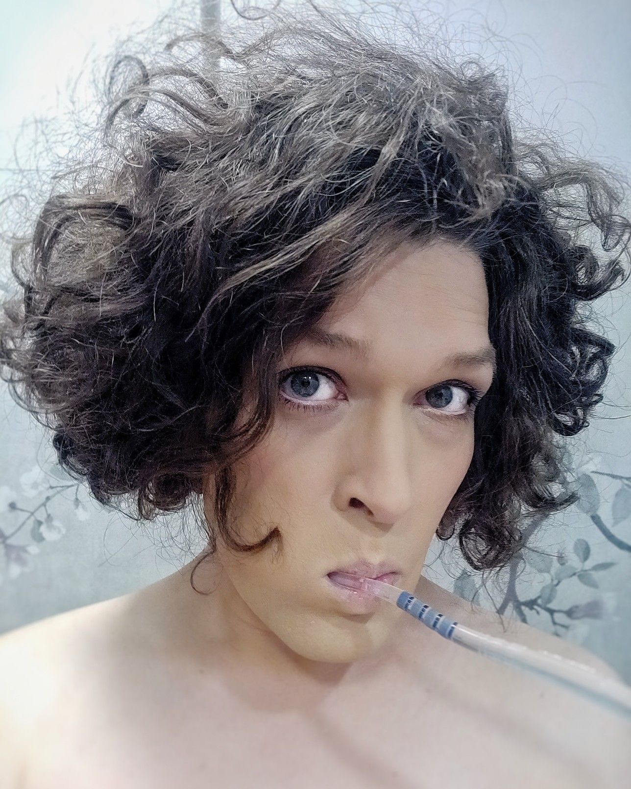 me in makeup looking cutesy with toothbrush in mouth