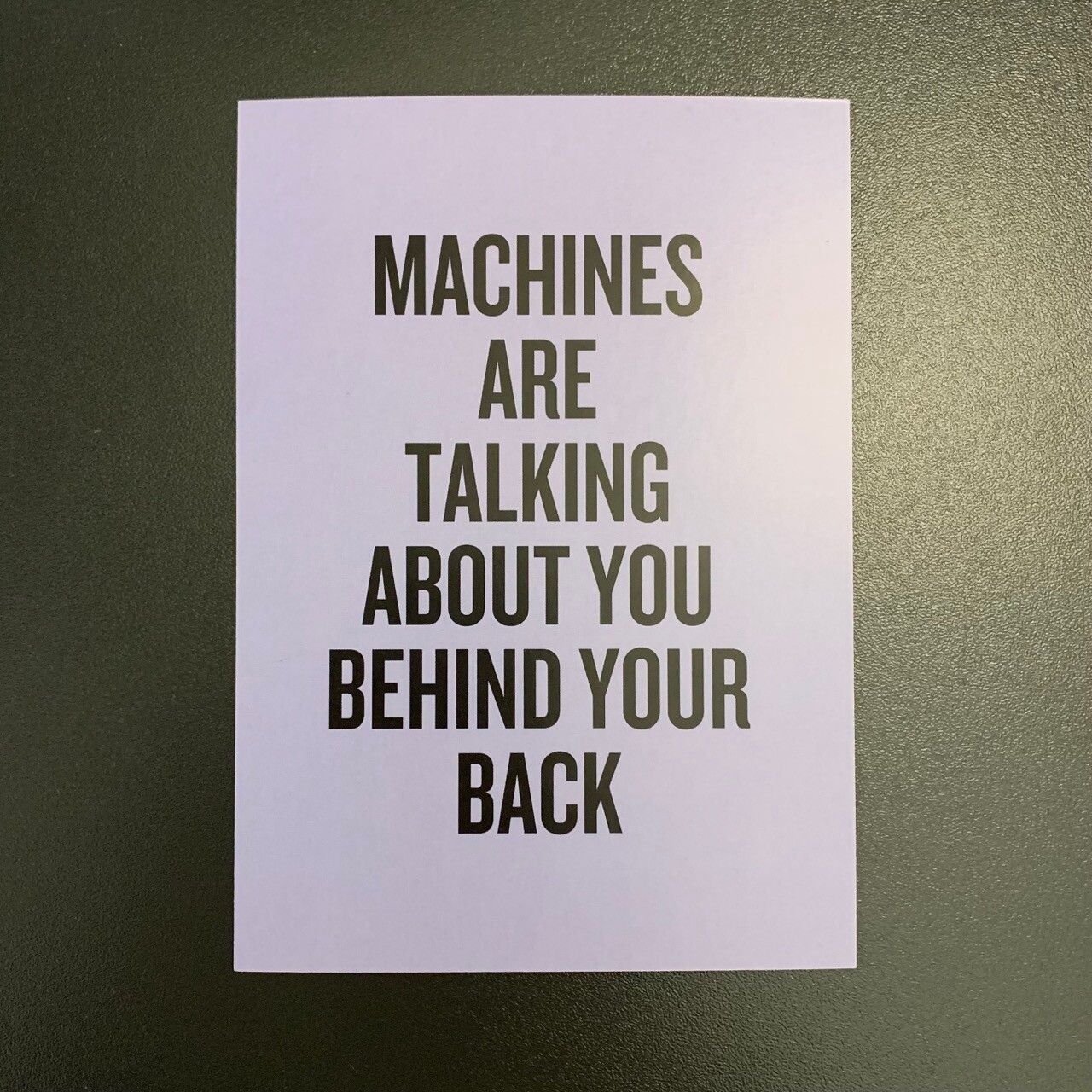 Postcard that says “machines are talking about you behind your back”.