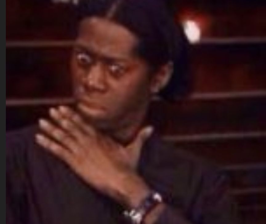 A still of the viral clutching-pearls meme from yesteryear, with a similar facial expression.