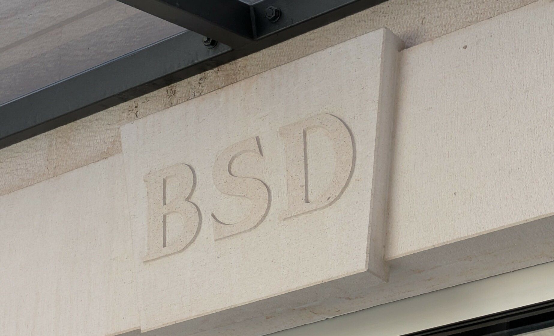 A shop in the old town of split, called BSD in big bold stone letters above the entrance of the shop itself.