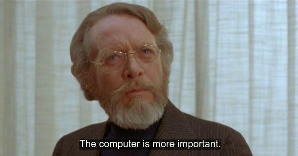 Screenshot of David Cronenberg's "Scanners" (1981) showing Daddy Dr. Paul Ruth in contemplative self-analysis shortly before being killed. The caption of his current thought reads "The computer is more important."