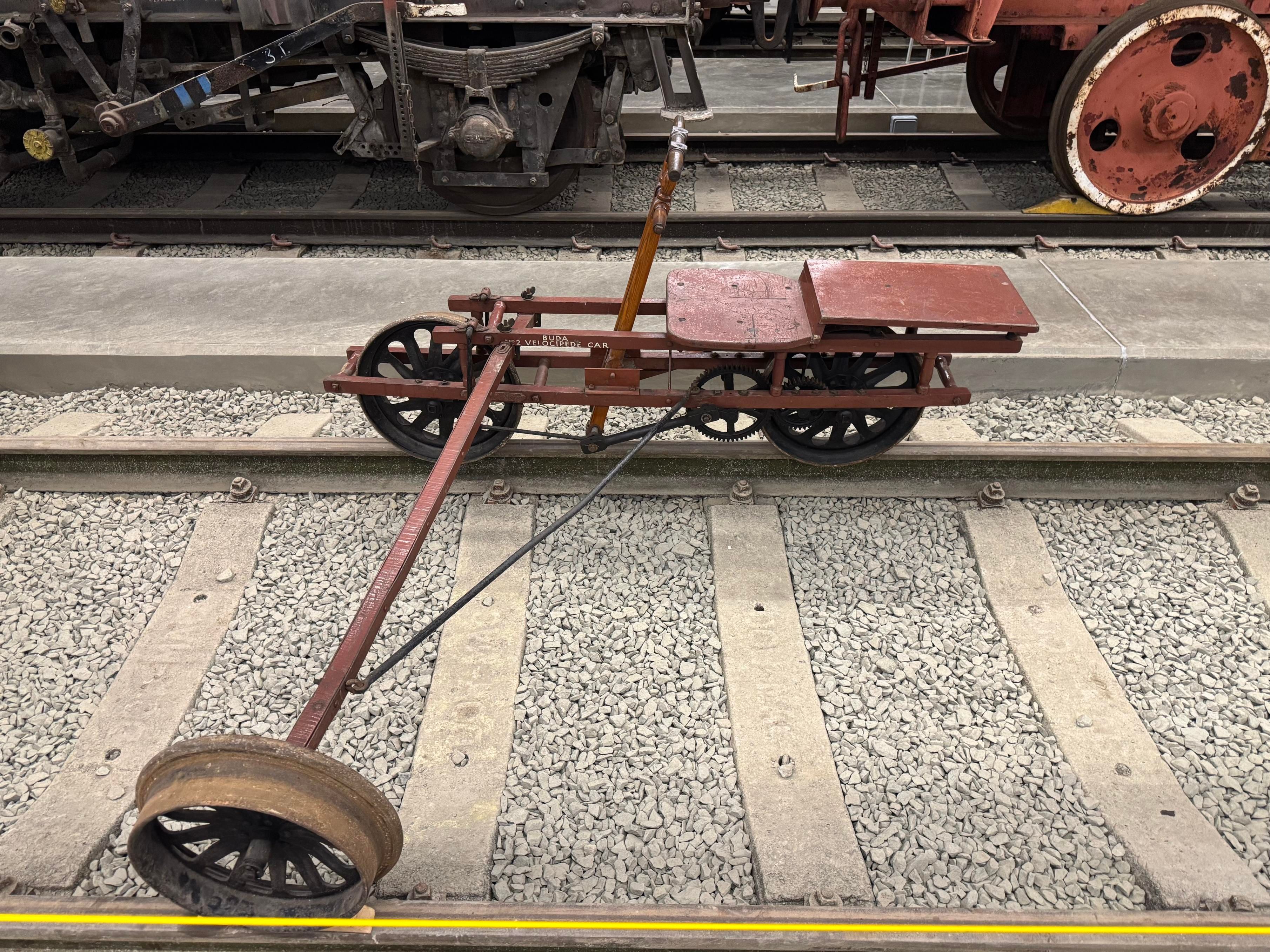 Another review of a different Velocipede, this time resting on the far rail with the outrigger close by