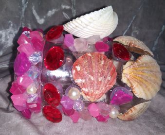 Glass jar in pinks reds and whites.