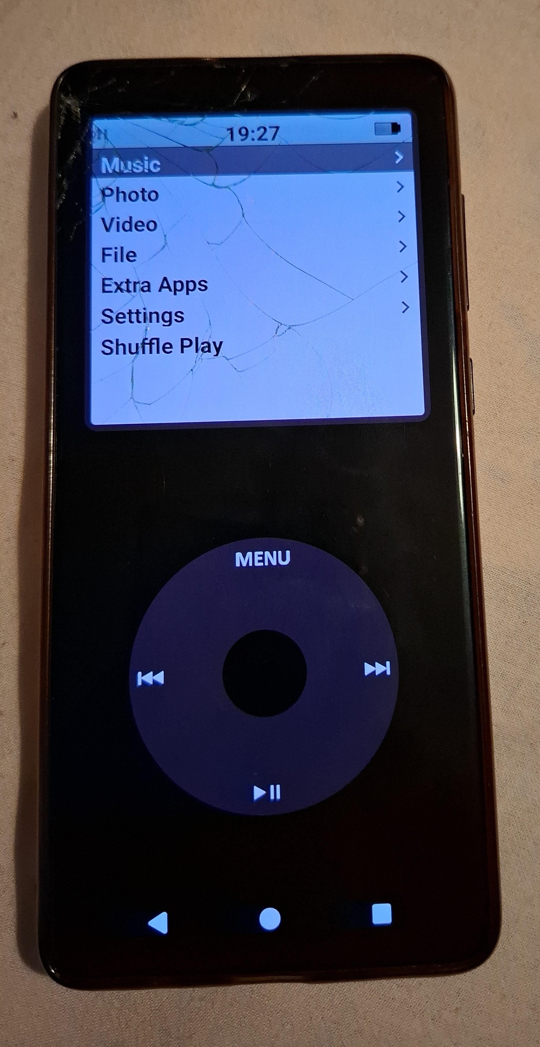 Photo of a Samsung Galaxy A71 with broken screen running lineage os and app called "Pod Classic"