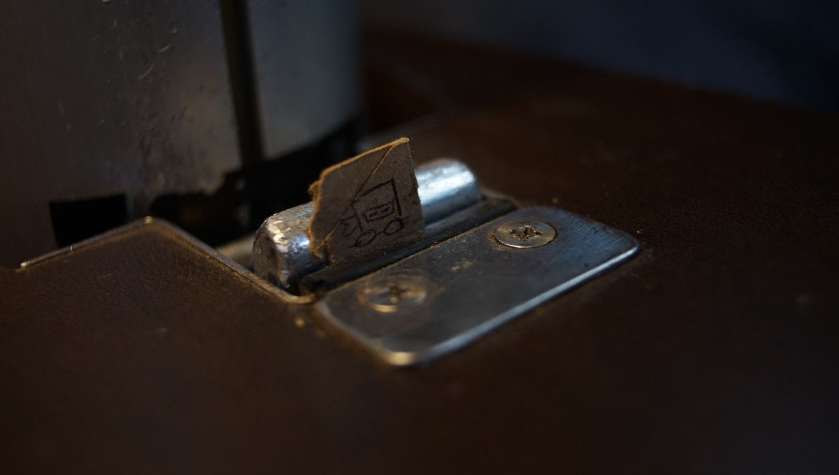 a little paper shim, keeping a sailboat table nice and tight. The shim has a very simple line drawing of our Ninja mascot, Little Ninj. 