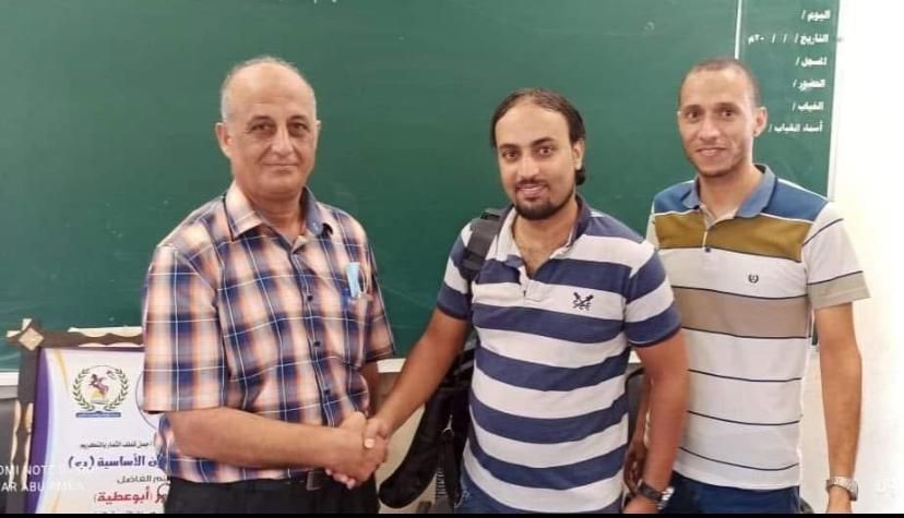 My father, Moein, shaking hands with one of his successful students.