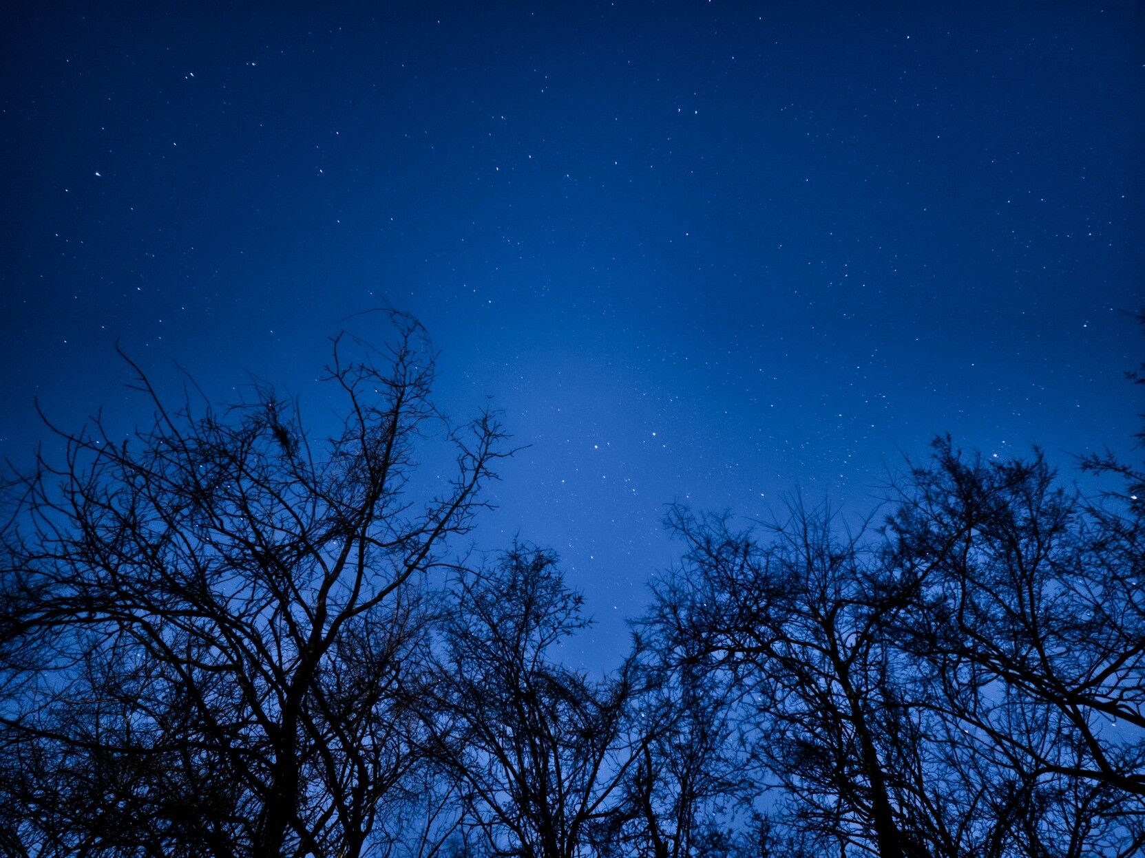 The same shot of the night sky over Arnold, Missouri ran through editing software. 