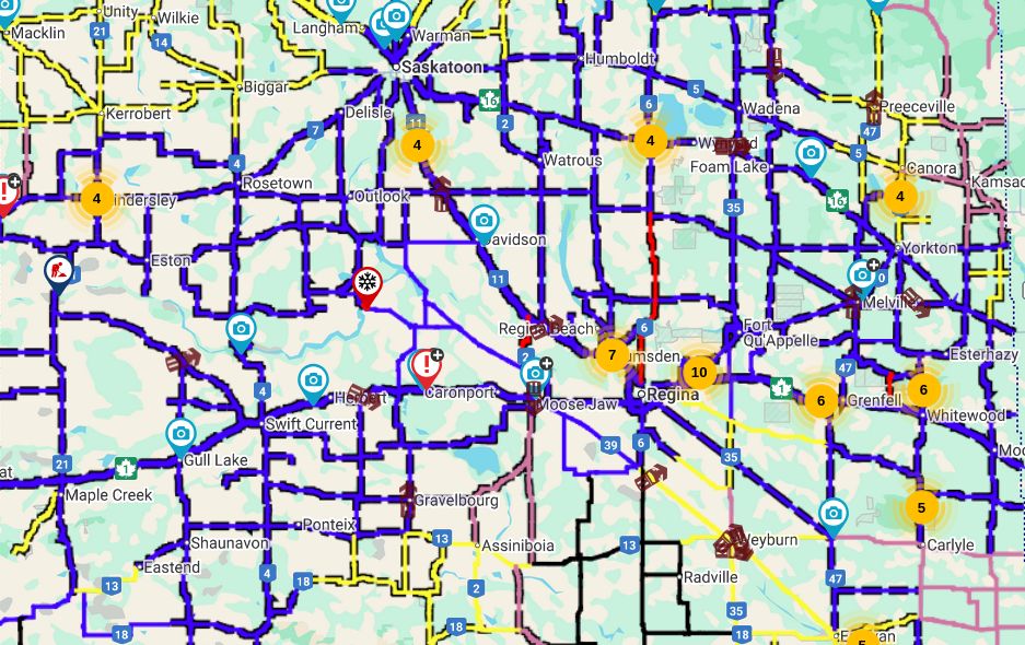 A screenshot of road conditions in the entire southern half of Saskatchewan.  Pretty much every single road is coloured blue for "travel not recommended" with a smattering of red for "closed"