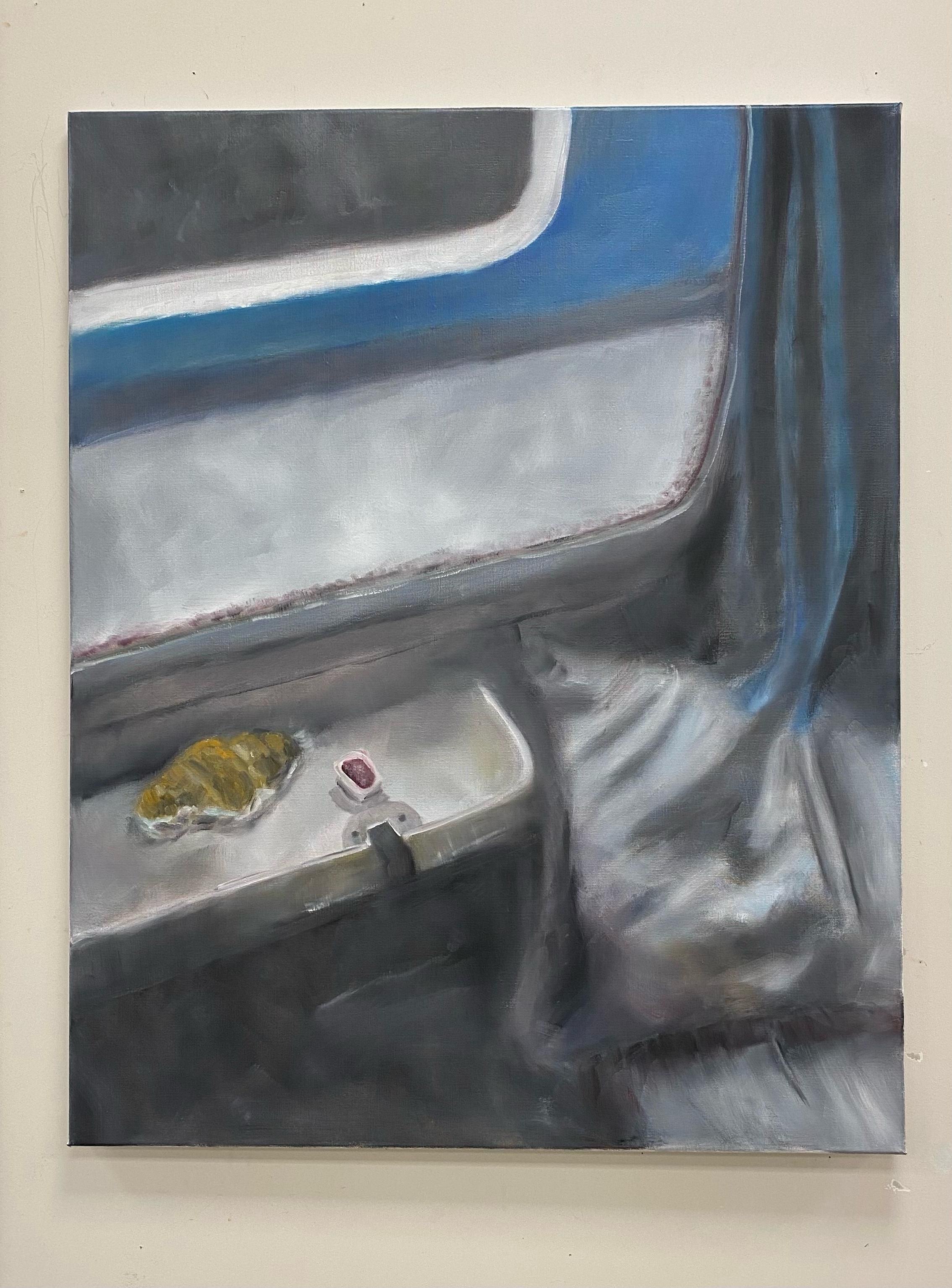 A train interior, we see a cushion on the right, it's slept on. A blue curtain on the right, a small train table on the left with a croissant and a small cup of raspberry jam on it. Through the window we see the blue/black/white colors of another train. The atmosphere is rather dark and lonely.