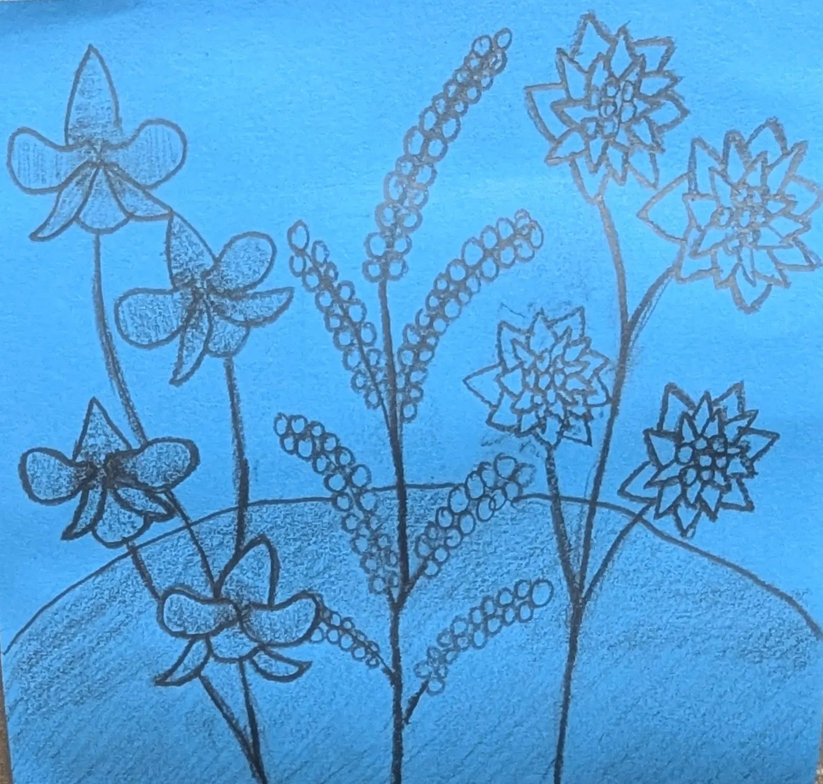 Flowers drawn on a blue sticky note. From left to right: orchids, lavender, and dahlias. 