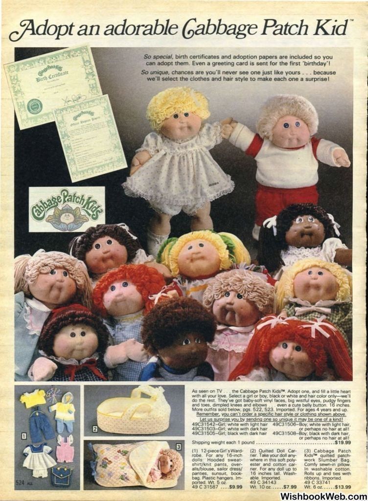 A 1983 Sears Wisbook catalog page showing a group of Cabbage Patch Kid dolls with different skin tones, hairstyles, and outfits, along with sample birth certificates and adoption papers. The page also displays accessory sets, including outfits, a yellow baby carrier, and a quilted doll blanket.