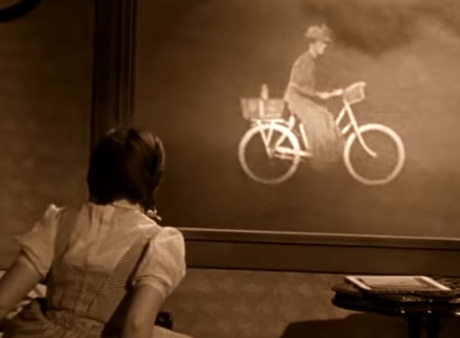 Woman on bicycle in a tornado in black and white