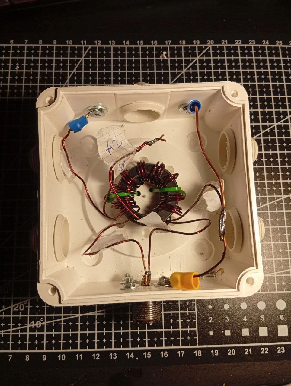 chaotic insides of a 9:1 transformer used to match impedances of external wire to 50 ohms