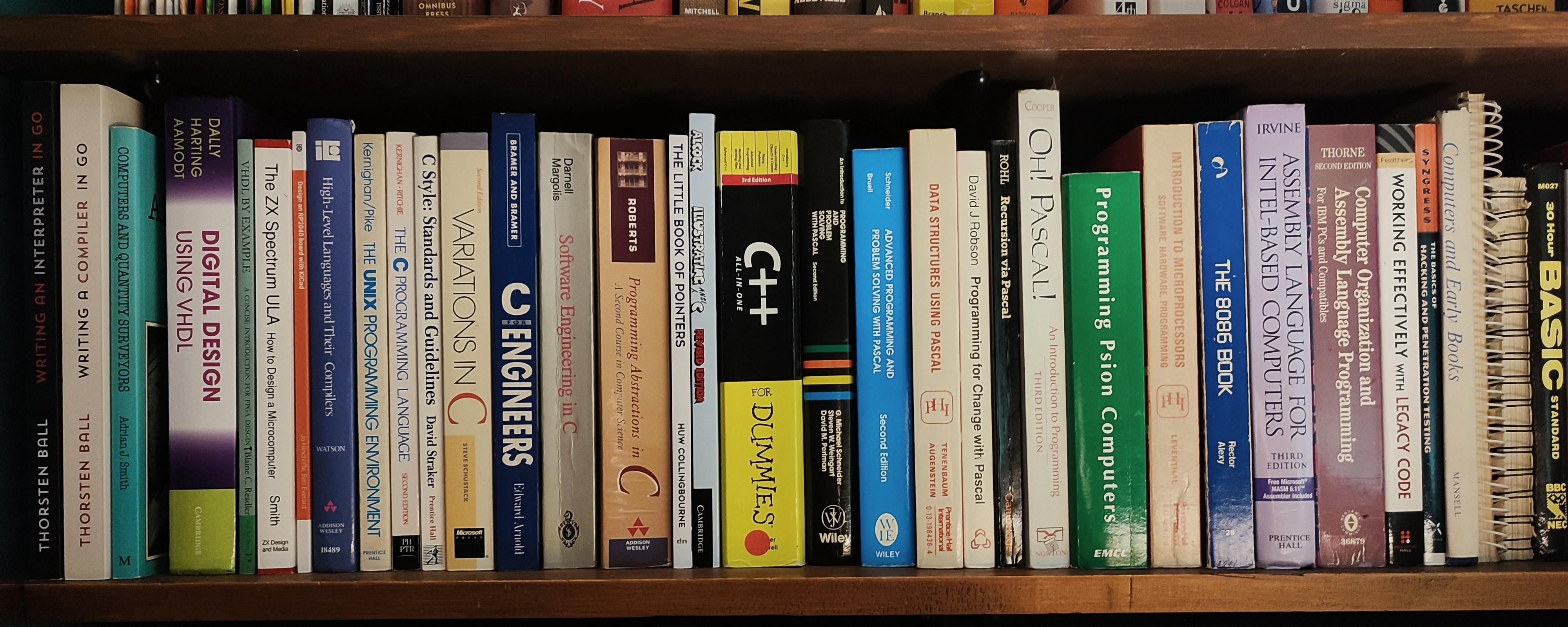 Shelf full of computing and computer science books. Full list in the main post.