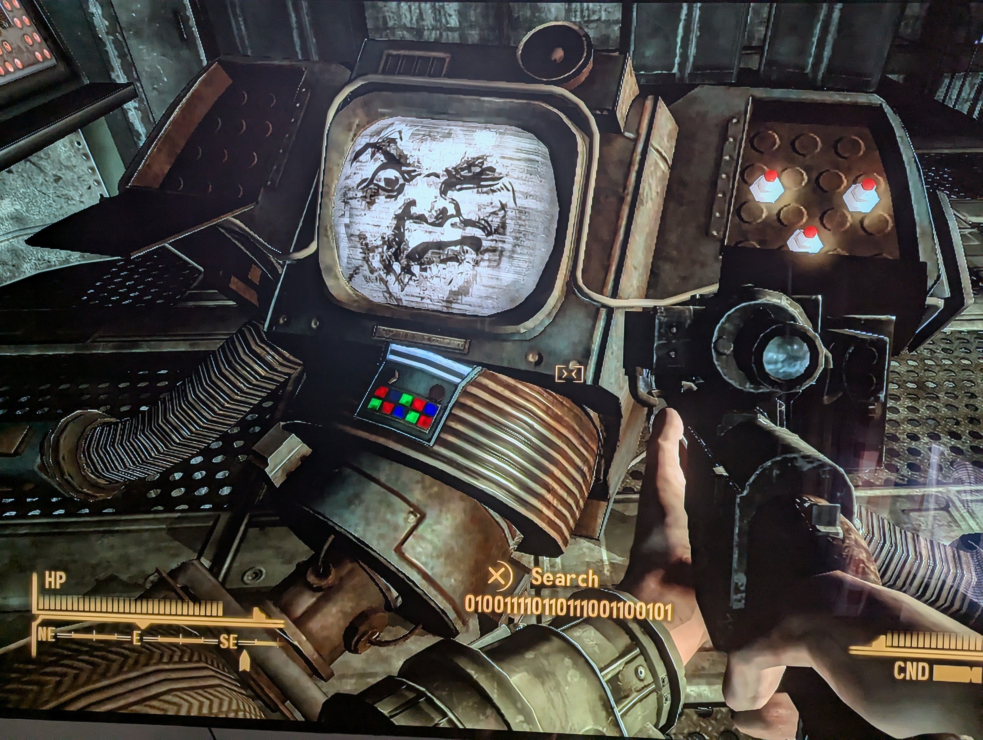 A gameplay image from fallout New Vegas. A securitron named 010110111101101001100101 is laying broken, no longer balancing its massive missile launching torso over its one wheel. Its chest is a large CRT projecting a black and white face. Its the moon's face from the 1902 movie A Trip To The Moon. Imagine an oversized food court cookie with an angry face and one eye poked out. 

If you've ever seen the Smashing Pumpkins music video for Tonight Tonight, they basically redid that movie and used the same moon face