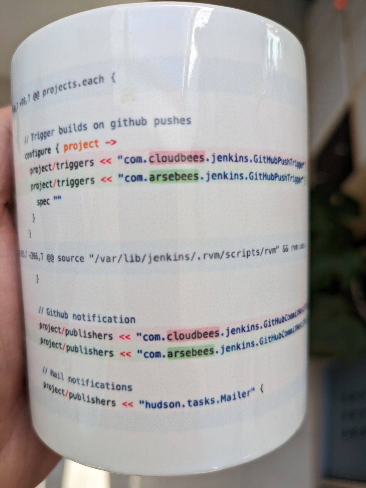 A mug printed with the diff from a github commit 