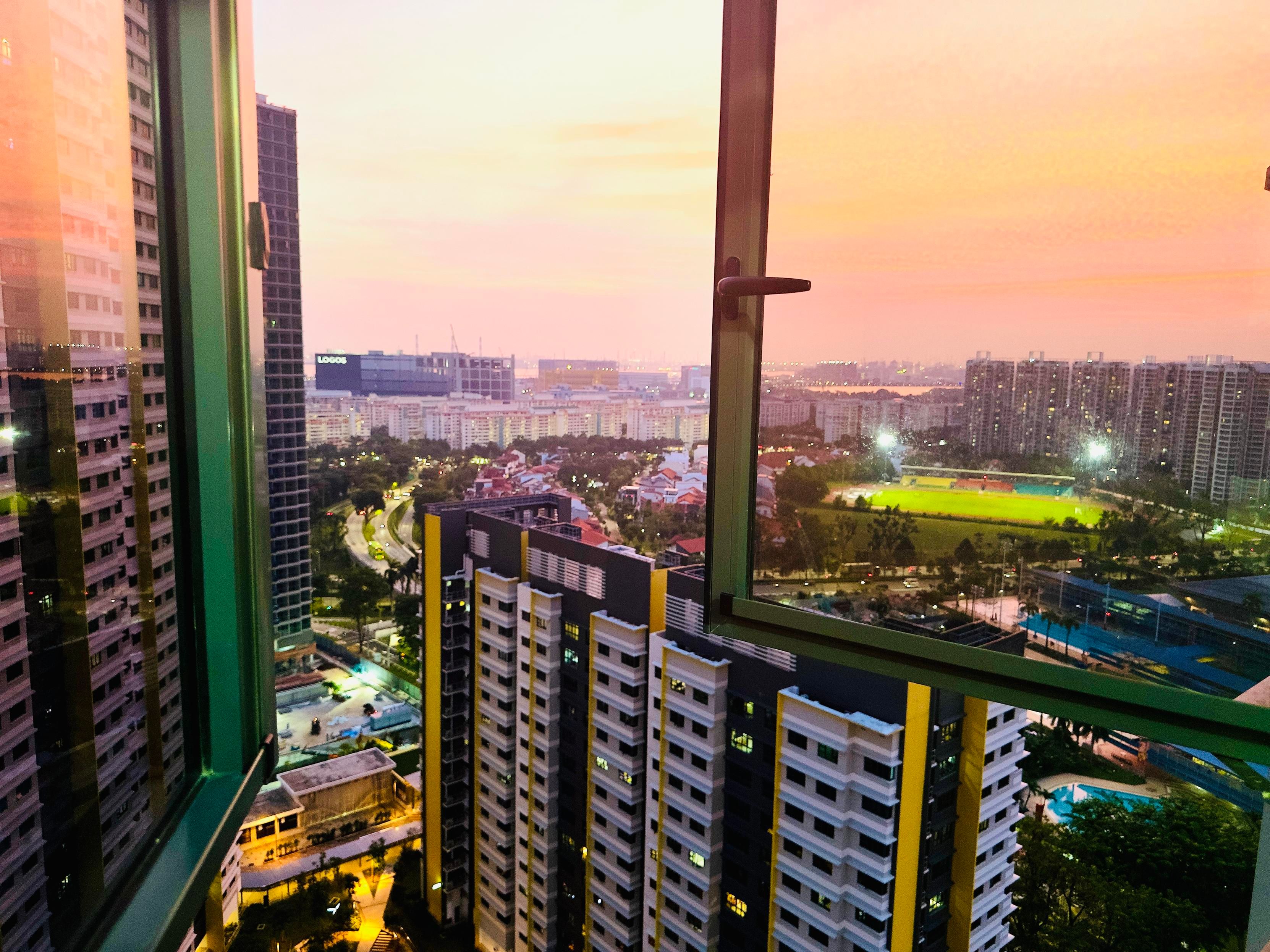 A photo of a sunset from a 40+ floor public housing building in Singapore 